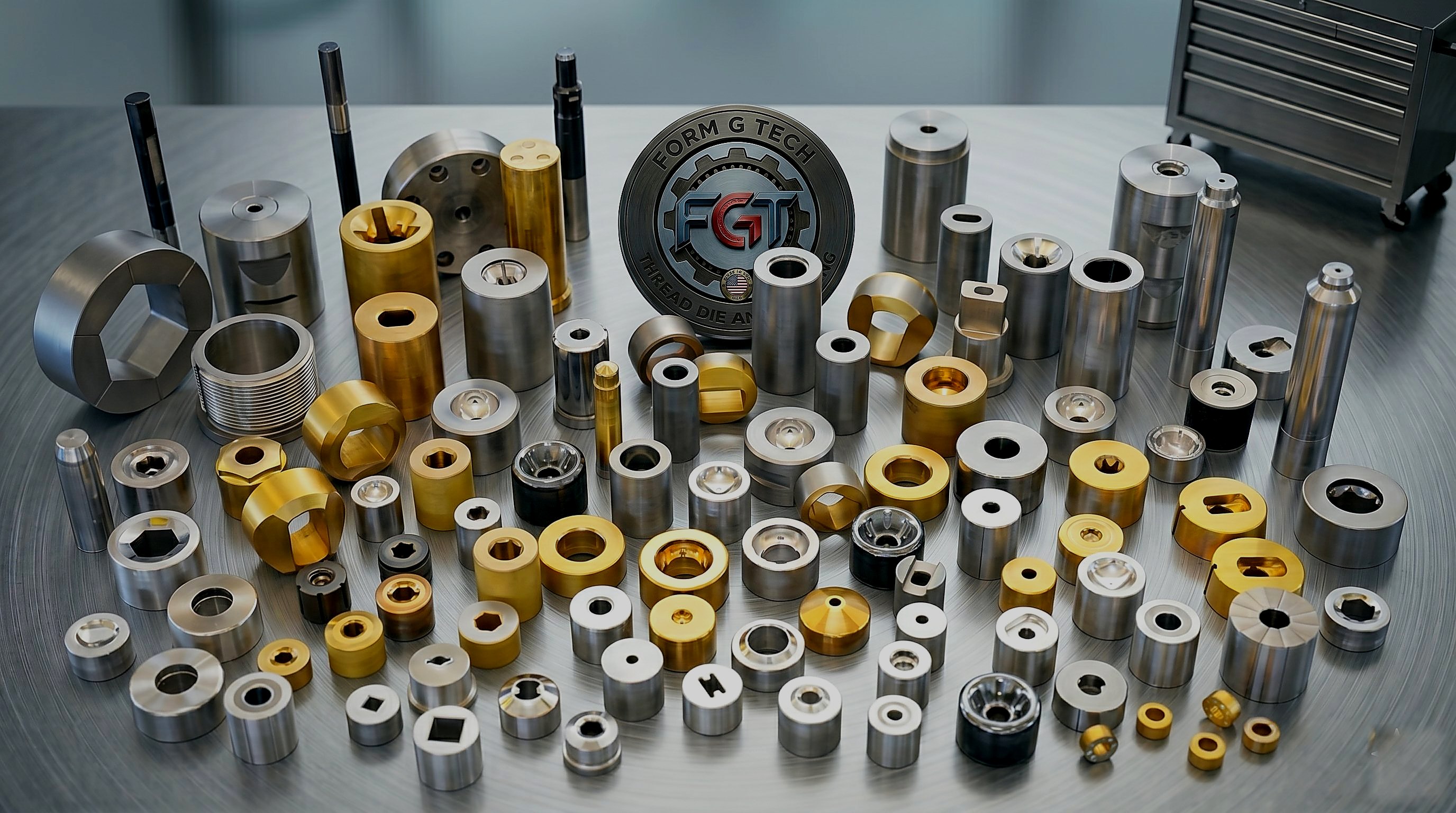 Form G Tech precision tooling and thread dies on a brushed metal surface